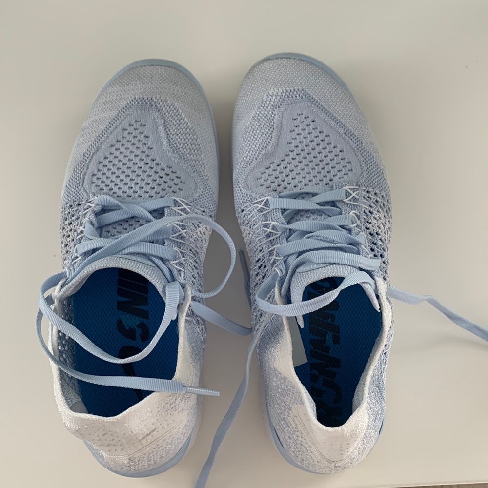Light blue Nike running shoes size 9